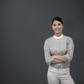 Composite image of selfassured businesswoman with folded arms Royalty Free Stock Photo