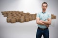 Composite image of serious warehouse manager standing with arms crossed Royalty Free Stock Photo