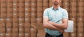 Composite image of serious warehouse manager standing with arms crossed Royalty Free Stock Photo