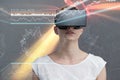 Composite image of serious woman using virtual reality simulator Royalty Free Stock Photo