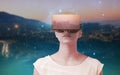 Composite image of serious woman using virtual reality simulator Royalty Free Stock Photo