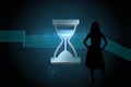 Composite image of shiny hourglass on black background Royalty Free Stock Photo