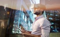 Composite image of side view of businessman holding virtual glasses and tablet computer Royalty Free Stock Photo