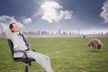 Composite image of side view of businessman leaning back in his chair Royalty Free Stock Photo