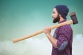 Composite image of side view of hipster with axe on shoulder Royalty Free Stock Photo