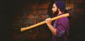 Composite image of side view of hipster with axe on shoulder Royalty Free Stock Photo