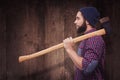 Composite image of side view of hipster with axe on shoulder Royalty Free Stock Photo