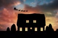 Composite image of side view of santa claus riding on sleigh during christmas Royalty Free Stock Photo