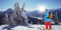 Composite image of skier with yellow backpack skiing Royalty Free Stock Photo