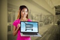 Composite image of smiling asian woman holding computer Royalty Free Stock Photo