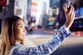 Composite image of smiling asian woman taking picture with camera Royalty Free Stock Photo