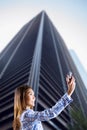 Composite image of smiling asian woman taking picture with camera Royalty Free Stock Photo