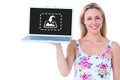 Composite image of smiling blonde holding laptop and posing