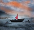 Composite image of smiling blonde turning in a sailboat Royalty Free Stock Photo