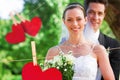 Composite image of smiling bride and groom in garden
