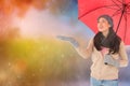 Composite image of smiling brunette feeling the rain Royalty Free Stock Photo
