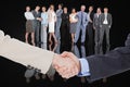 Composite image of smiling business people shaking hands Royalty Free Stock Photo