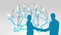 Composite image of smiling business people shaking hands while looking at the camera Royalty Free Stock Photo
