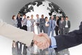 Composite image of smiling business people shaking hands while looking at the camera Royalty Free Stock Photo