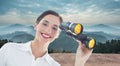 Composite image of smiling business woman with binoculars Royalty Free Stock Photo