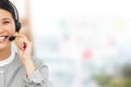 Composite image of smiling businesswoman with headset on