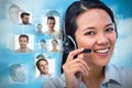 Composite image of smiling businesswoman using headset Royalty Free Stock Photo