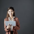 Composite image of smiling businesswoman using a tablet Royalty Free Stock Photo