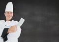 Composite image of smiling chef holding a knife Royalty Free Stock Photo