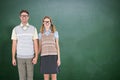 Composite image of smiling geeky hipster couple holding hands