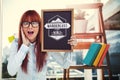 Composite image of smiling hipster woman holding blackboard Royalty Free Stock Photo