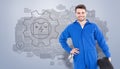 Composite image of smiling male mechanic holding tire Royalty Free Stock Photo