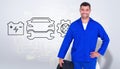 Composite image of smiling male mechanic holding tire Royalty Free Stock Photo