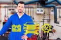 Composite image of smiling male mechanic holding tire Royalty Free Stock Photo