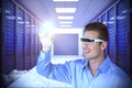 Composite image of smiling man pointing while using virtual video glasses Royalty Free Stock Photo