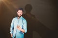 Composite image of smiling man using mobile phone Royalty Free Stock Photo