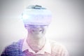 Composite image of smiling man wearing virtual reality glasses Royalty Free Stock Photo