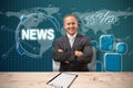 Composite image of smiling manager with arms crossed in warehouse