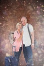 Composite image of smiling older couple going on their holidays Royalty Free Stock Photo