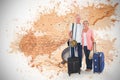 Composite image of smiling older couple going on their holidays Royalty Free Stock Photo