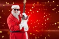 Composite image of smiling santa claus playing a guitar Royalty Free Stock Photo