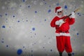 Composite image of smiling santa claus playing guitar Royalty Free Stock Photo