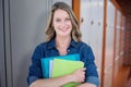 Composite image of smiling student holding notebook and file Royalty Free Stock Photo