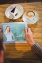 Composite image of smiling teacher gesturing thumbs up in front of blackboard Royalty Free Stock Photo