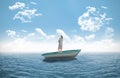 Composite image of smiling thoughtful businesswoman in a sailboat Royalty Free Stock Photo