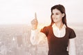 Composite image of smiling woman pointing something with her finger Royalty Free Stock Photo