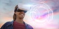 Composite image of smiling young man wearing virtual reality simulator Royalty Free Stock Photo