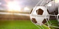 Composite image of soccer ball in goal net Royalty Free Stock Photo