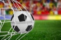 Composite image of soccer ball in goal net Royalty Free Stock Photo