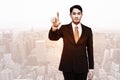 Composite image of stern asian businessman pointing