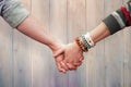 Composite image of students holding hands Royalty Free Stock Photo